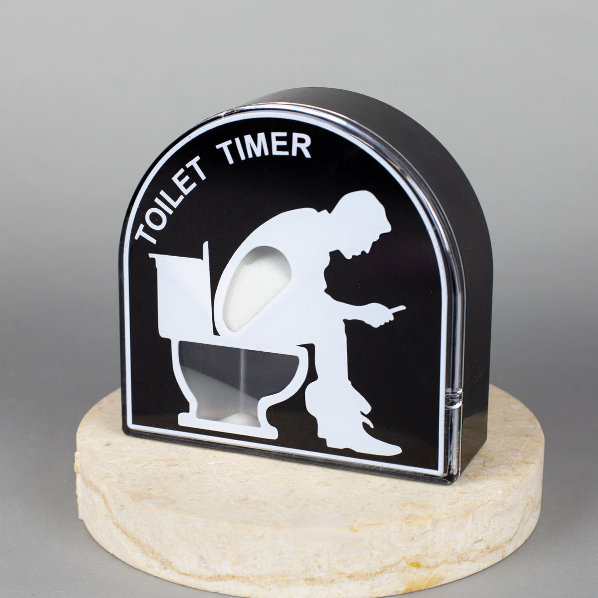Toiletten-Timer aus Kunststoff auf dekorativem Sockel präsentiert