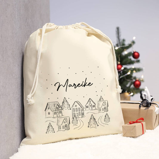 Geschenksack mit verschneiter Stadt und Name als Motiv
