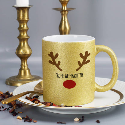 Festlich glitzernde Tasse mit weihnachtlichem Motiv