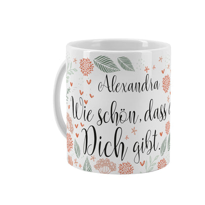 Weiße Tasse mit Spruch "Wie schön, dass es Dich gibt", floralen Elementen und Name