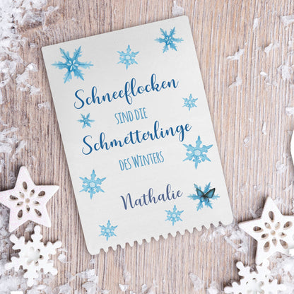 Eiskratzer mit Schneeflocken