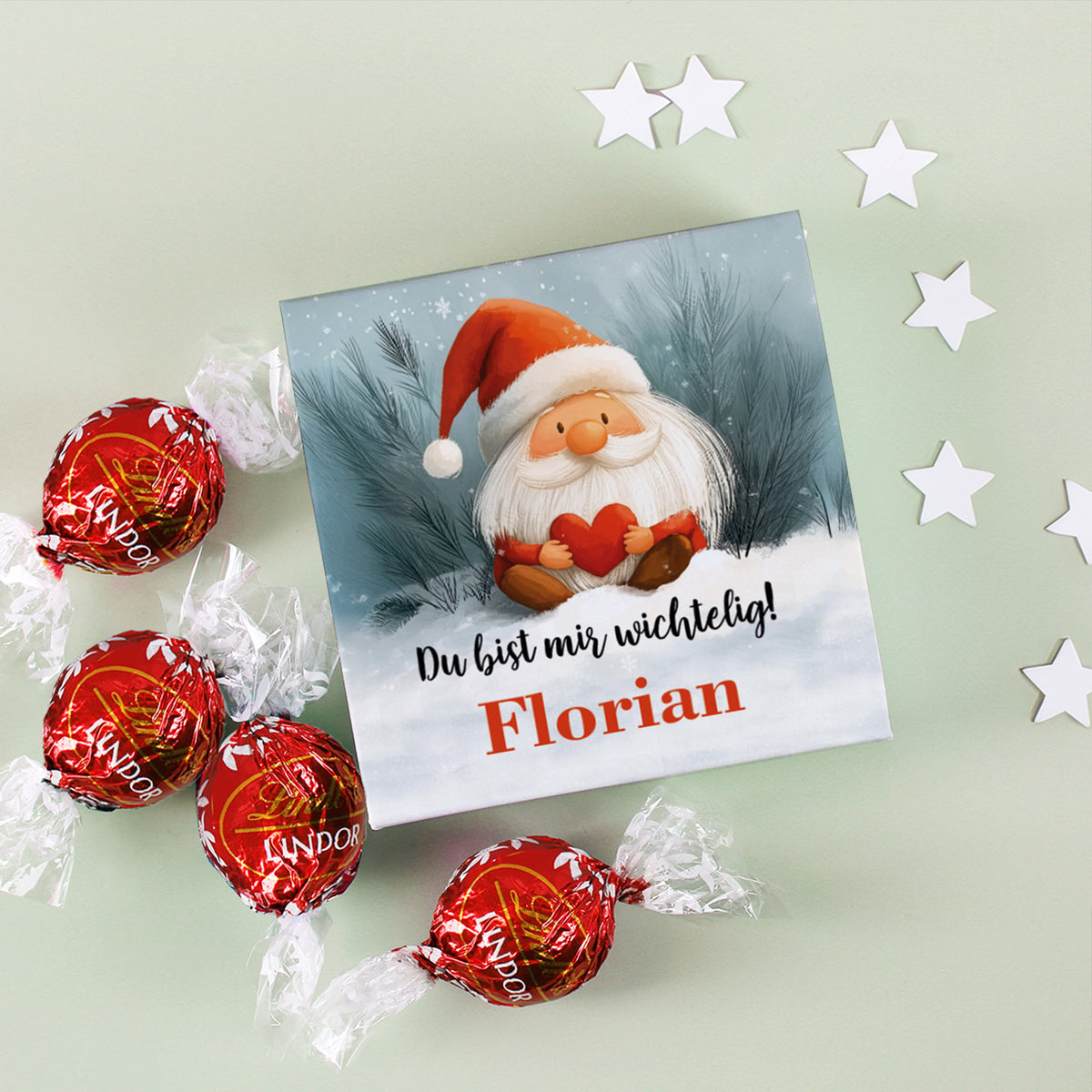 Bedruckte Schachtel mit Wichtel-Design und Name „Florian“, dekoriert mit Sternen und Lindor-Kugeln