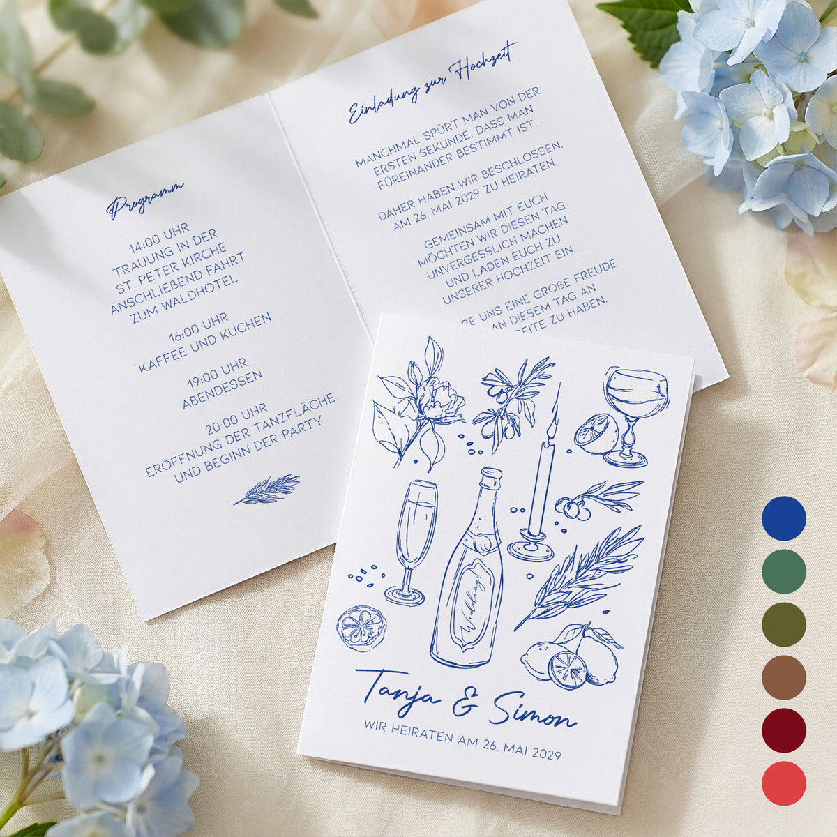 Hochzeitseinladung Klappkarte im mediterranen Stil mit Beispieltext und blauer Schrift, daneben Farbmuster zur Auswahl der Druckfarbe
