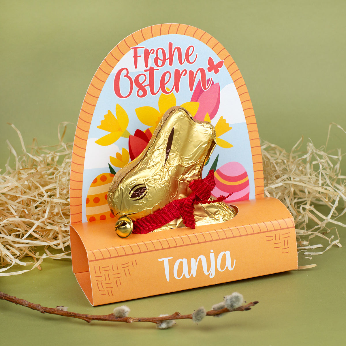 Personalisierter Lindt Goldhase 100 g in Osterverpackung mit „Frohe Ostern“-Motiv und Name Tanja