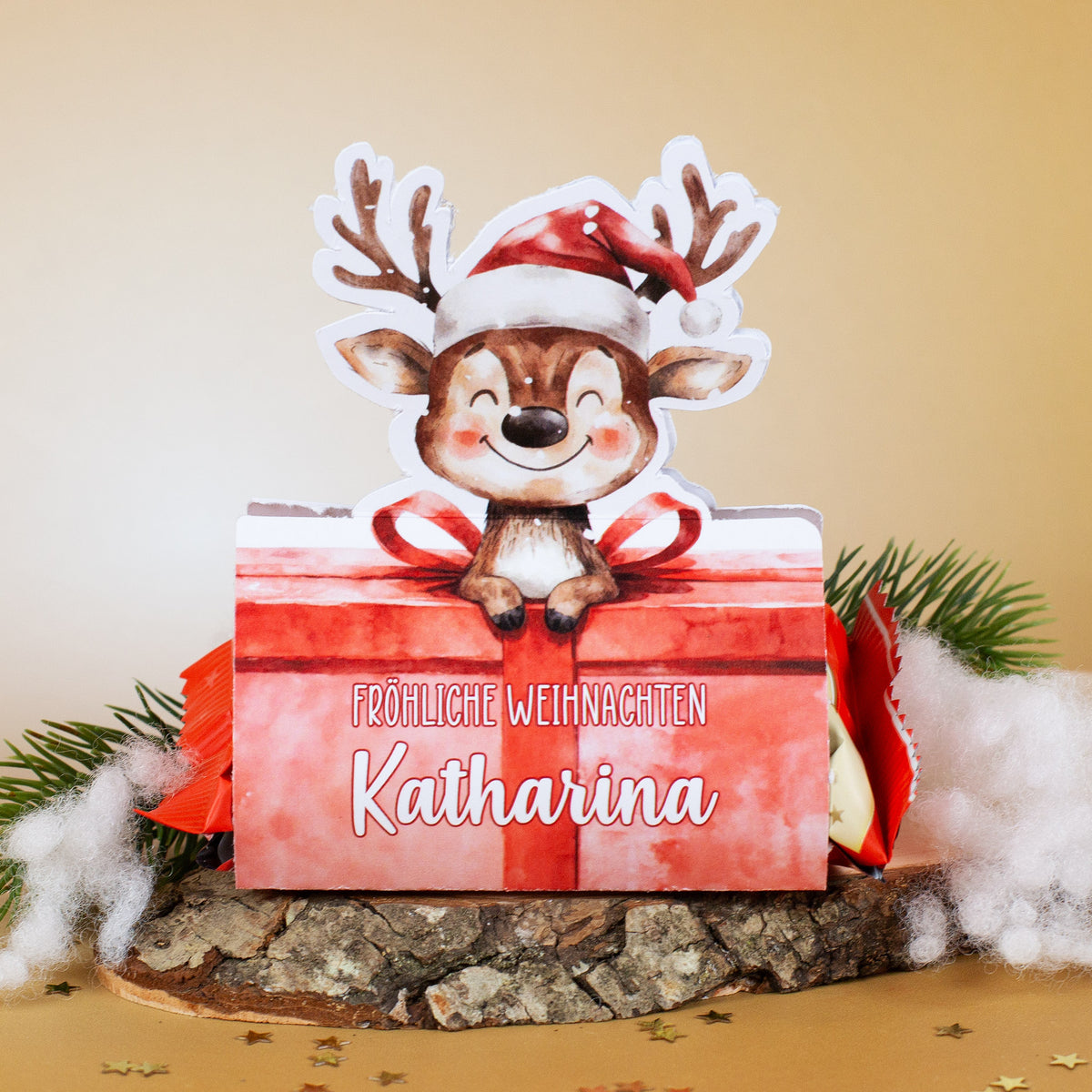 Mini-Stollen-Verpackung mit Rentier und personalisiertem Namen Katharina auf goldenem Hintergrund