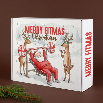 Personalisierter Adventskalender Merry Fitmas mit Name und Weihnachtsmann beim Fitnesstraining