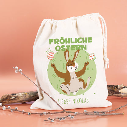 Personalisierter Geschenksack zu Ostern „Fröhliche Ostern“ mit jonglierendem Osterhasen