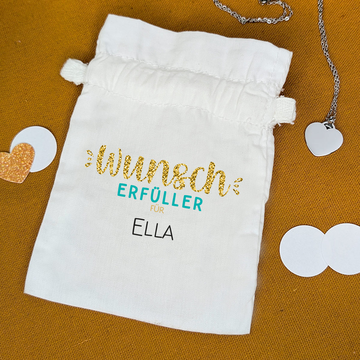 Geldgeschenkbeutel mit Schriftzug Wunscherfüller für Ella – flachliegend mit Dekoherz