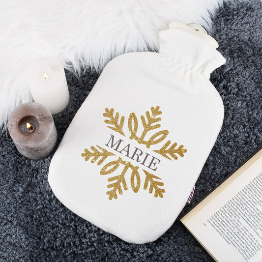 Kuschelige Wärmflasche mit Schneeflocke in Goldoptik und Name bedruckt